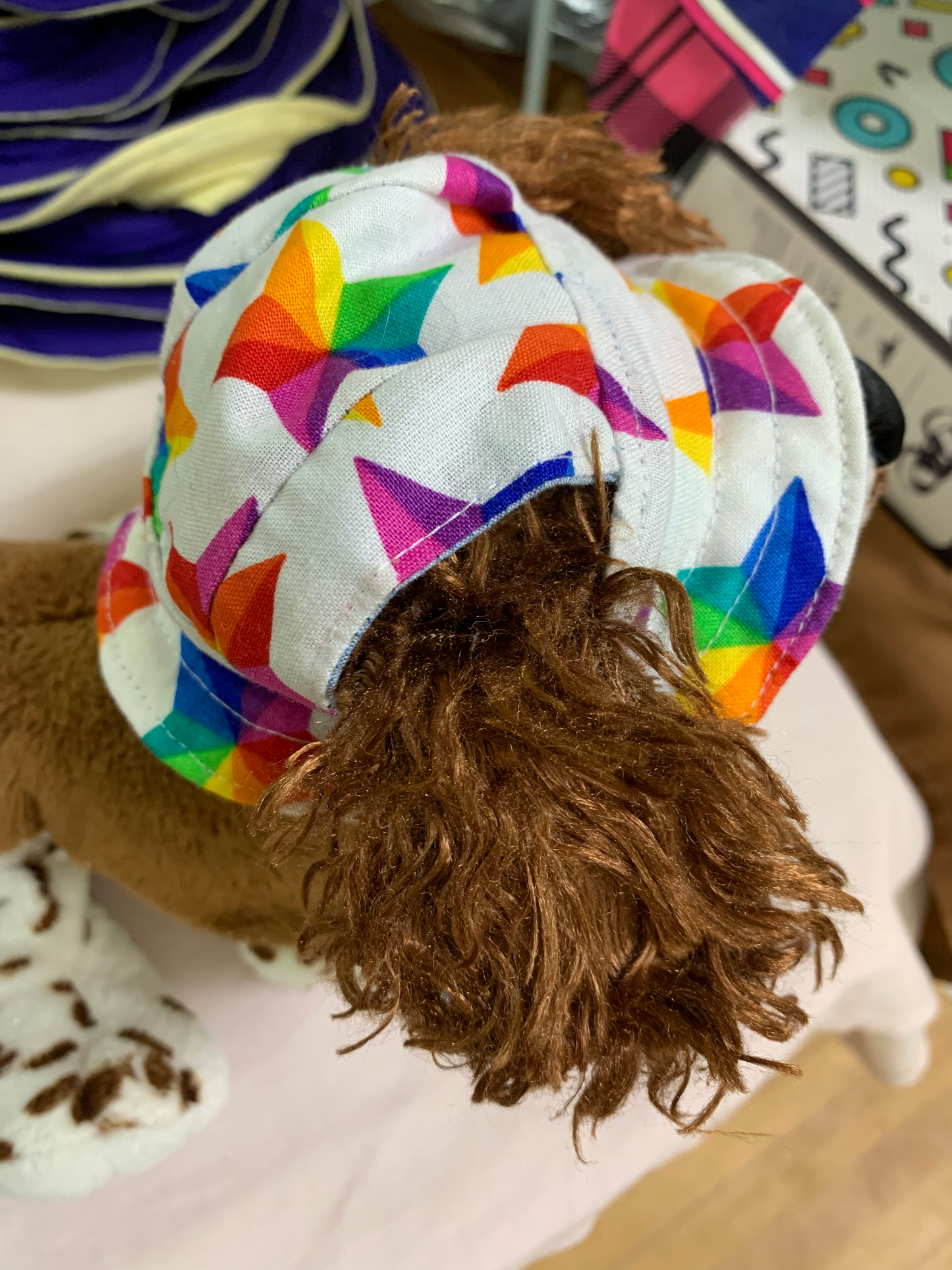 Multicoloured stars on white Pet Bucket Hat image 1