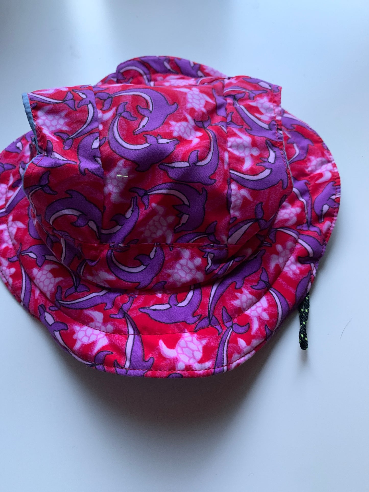 Dolphins and turtles on pink pet hats