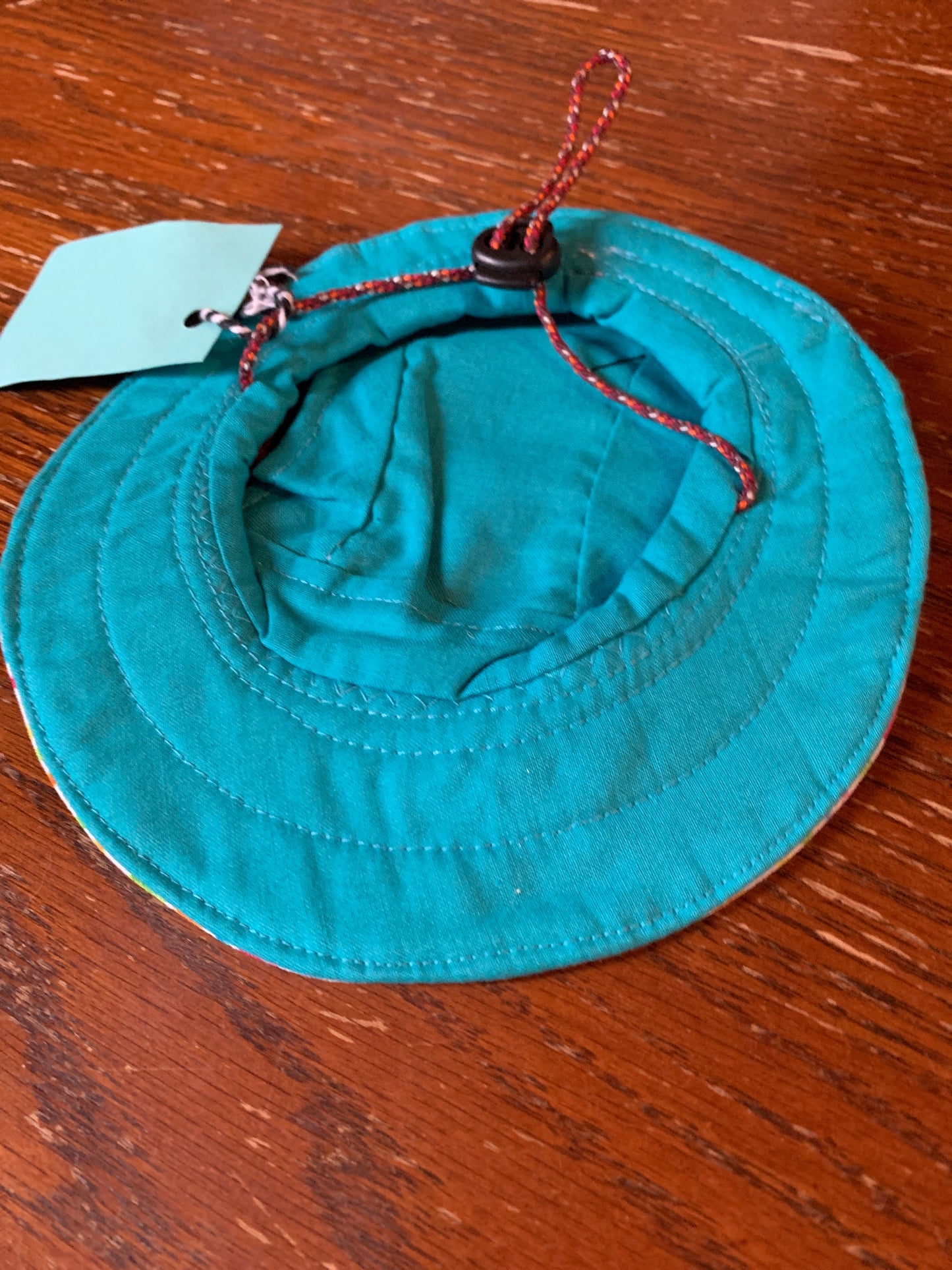 Multicoloured blocks and dots on white pet bucket hat