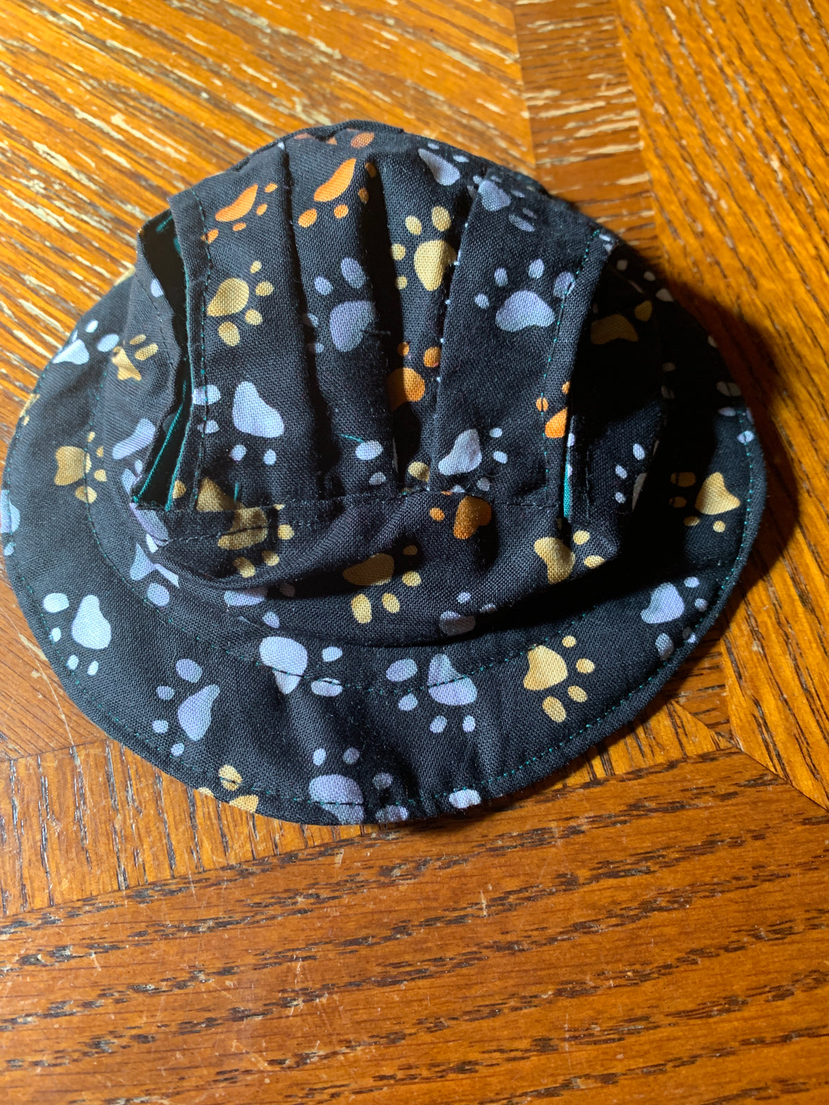 pawprints on black pet bucket hat