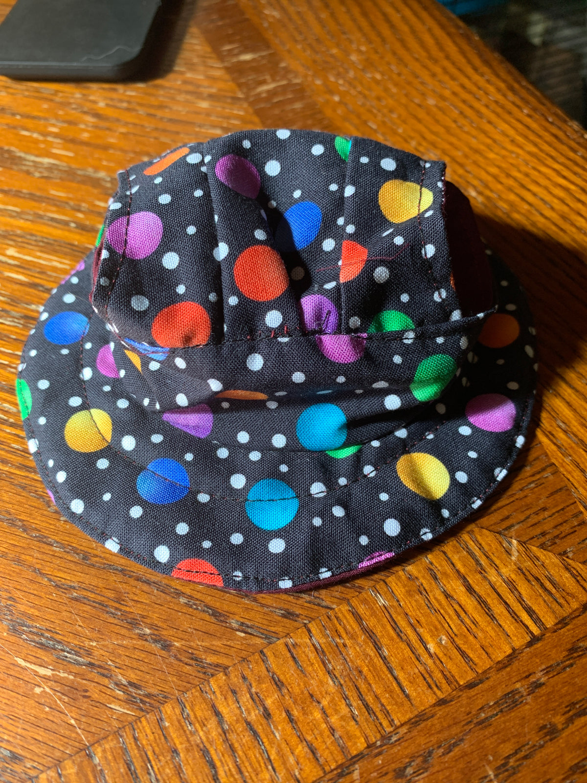 Multicolored dots on black pet bucket hat