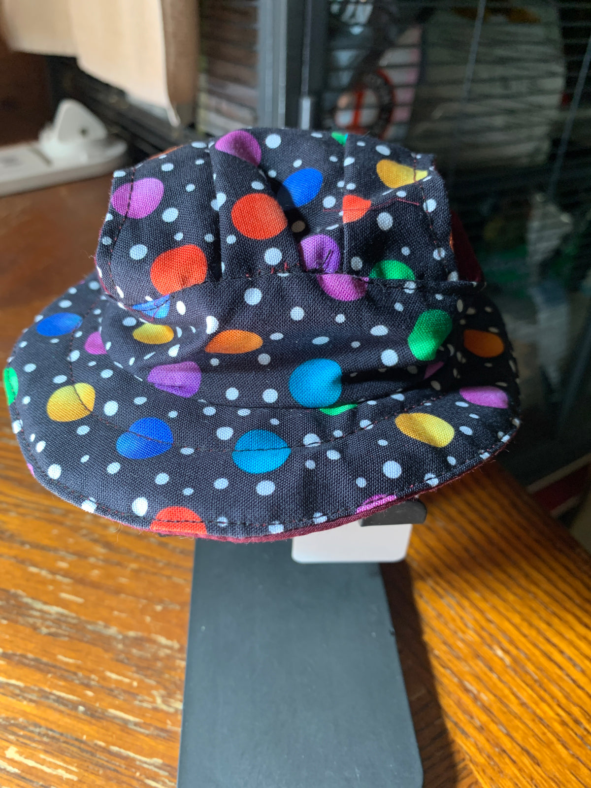 Multicolored dots on black pet bucket hat